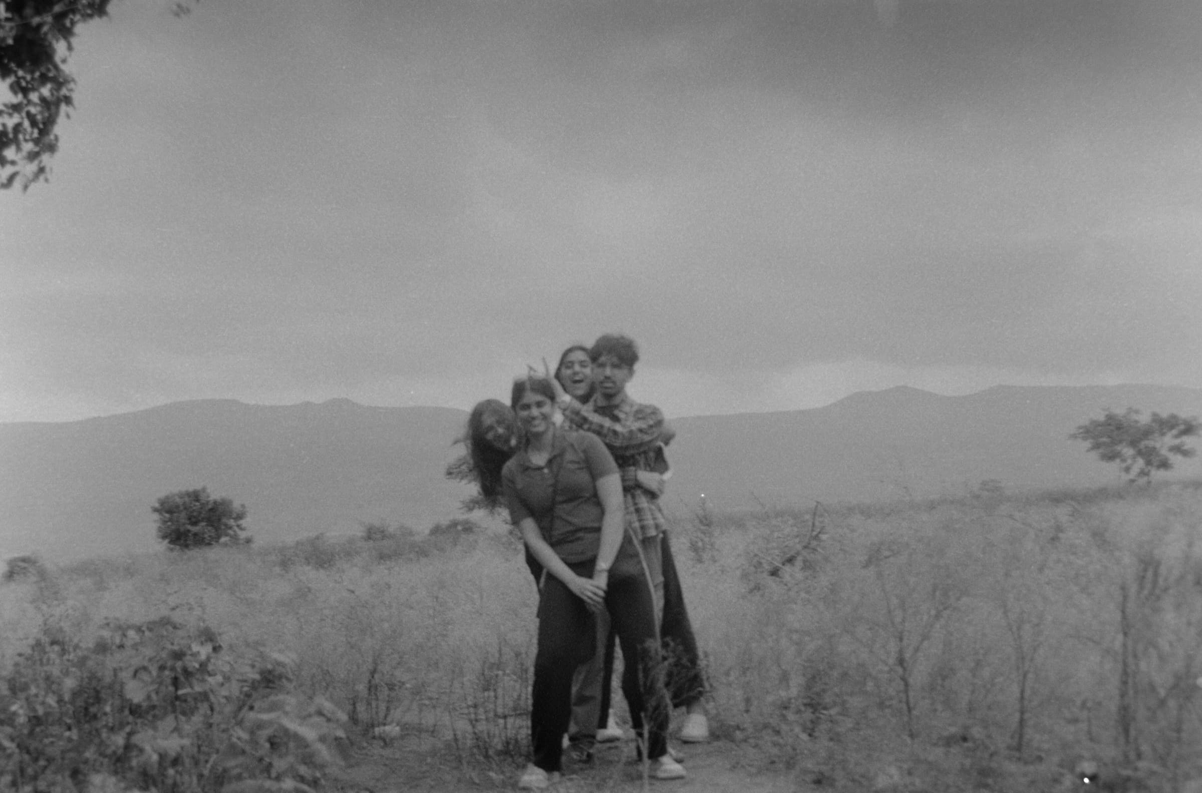 Two figures embracing in an open landscape, Mahabaleshwar