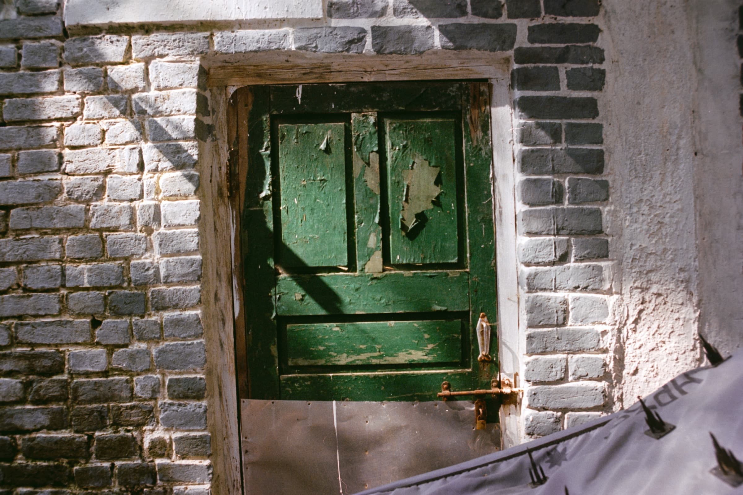 A green door in a brick wall, Dharamshala