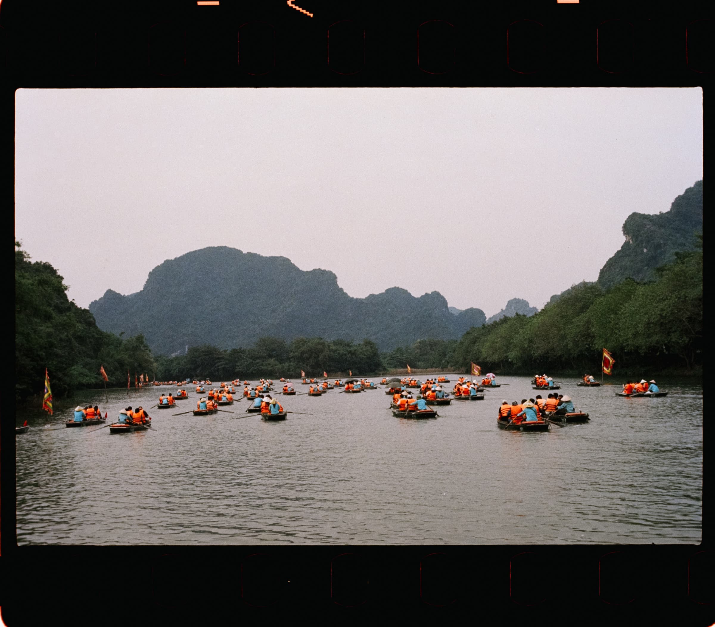 Rowboats between limestone karsts, Ninh Binh
