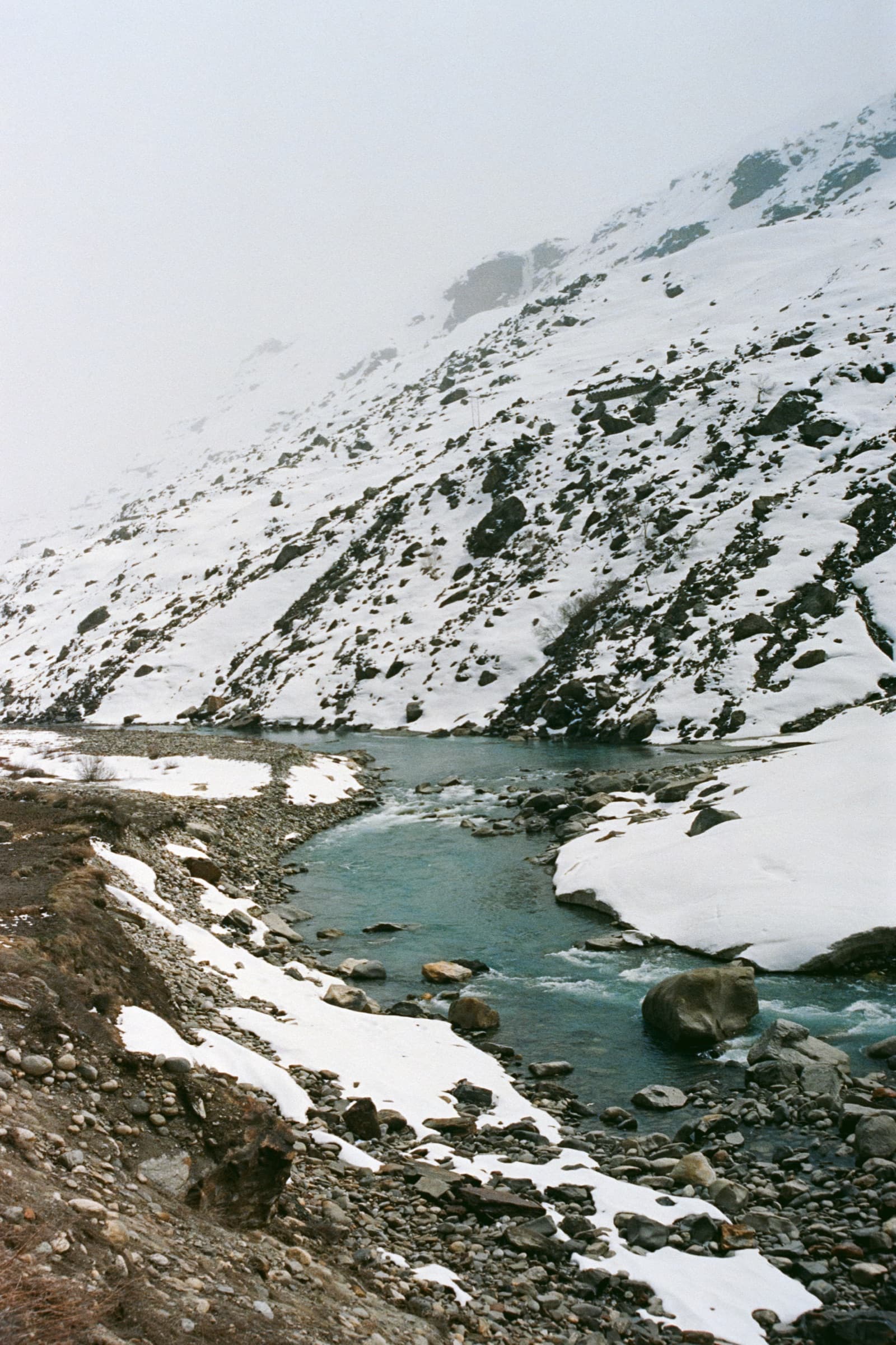 A meltwater stream below the snow, Manali